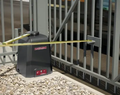 A close-up of an Electric Gate Opener installed on a metal gate, ensuring automated entry.