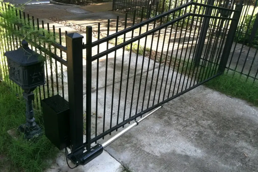 Automated gate with operator and gate keypad, providing secure residential access.
