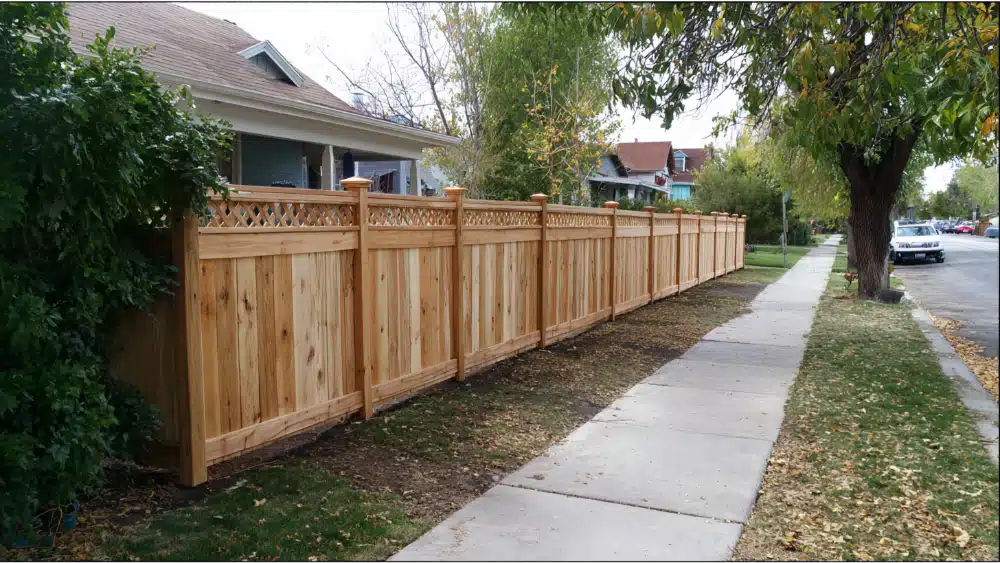 Wood fencearound a house near road