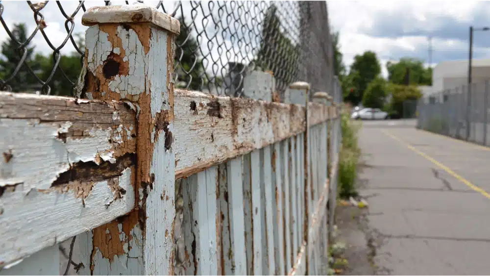 damage commercial fence