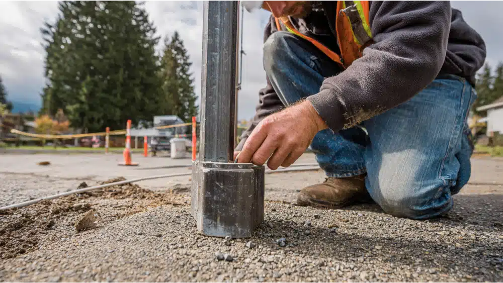 Installers Position the Base Plate Carefully