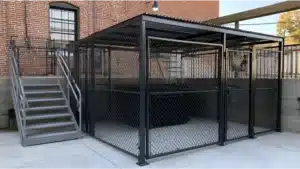 Commercial dumpster enclosure with secure metal gates