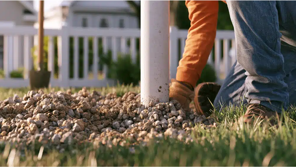 Gravel under vinyl fence post