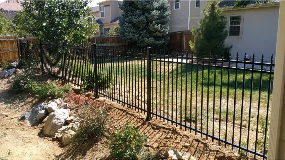 Stepped metal fence