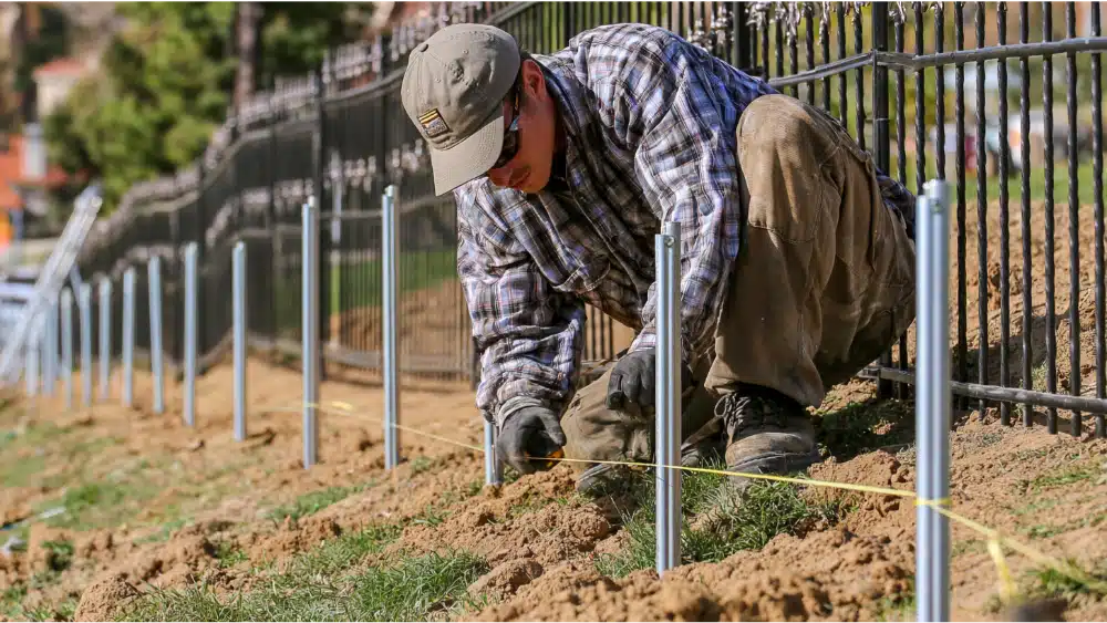 Installed ornamental fence on uneven ground